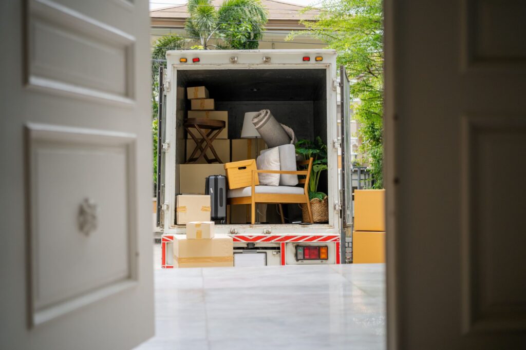 Professional house movers in Derby loading protected furniture